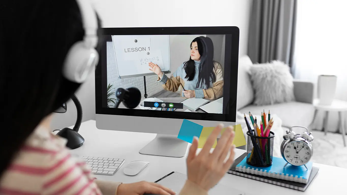 A student attending an interactive online lesson, guided by a tutor on how to teach online, showcasing a modern virtual learning platform.